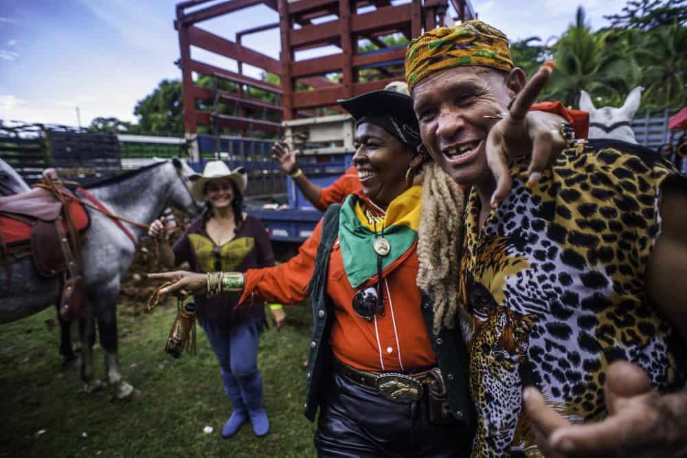 Spectator wearing a Rasta-themed outfit, enjoying the Rasta Tope festivities