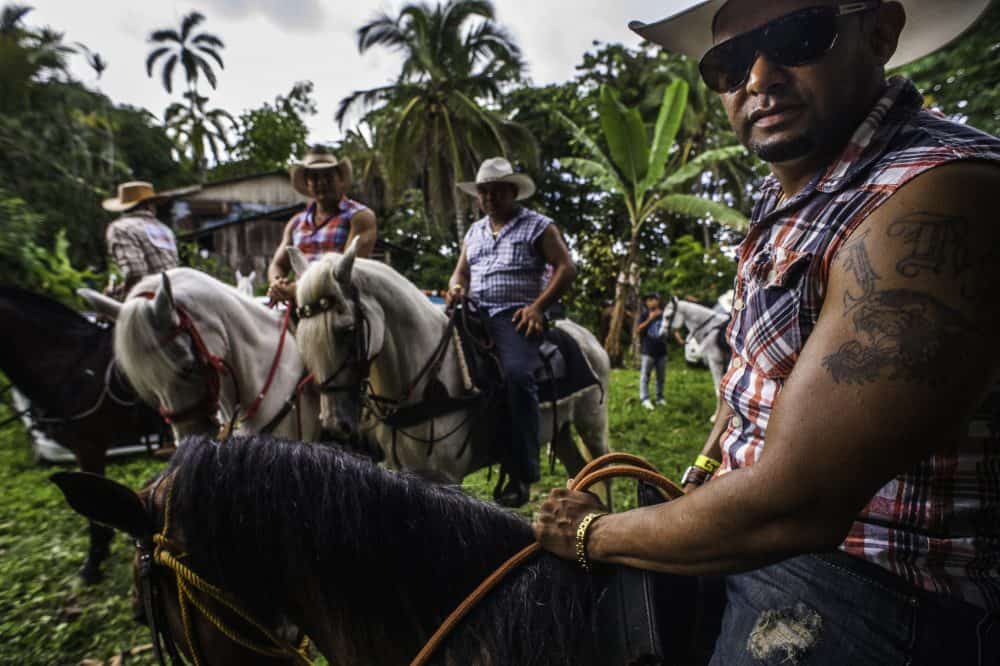 A group of horses and riders preparing to join the Rasta Tope parade