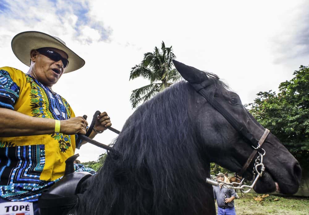 A rider wearing a Rasta-themed outfit, enjoying the Rasta Tope festivities