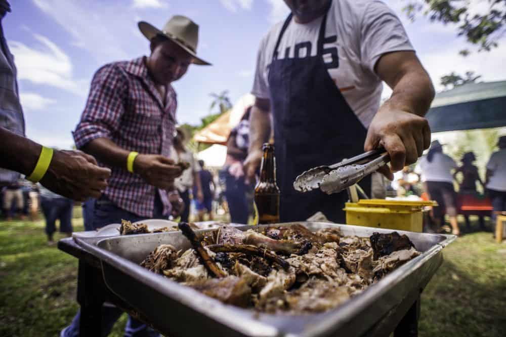 Caribbean food vendors serving traditional dishes at the Rasta Tope celebration