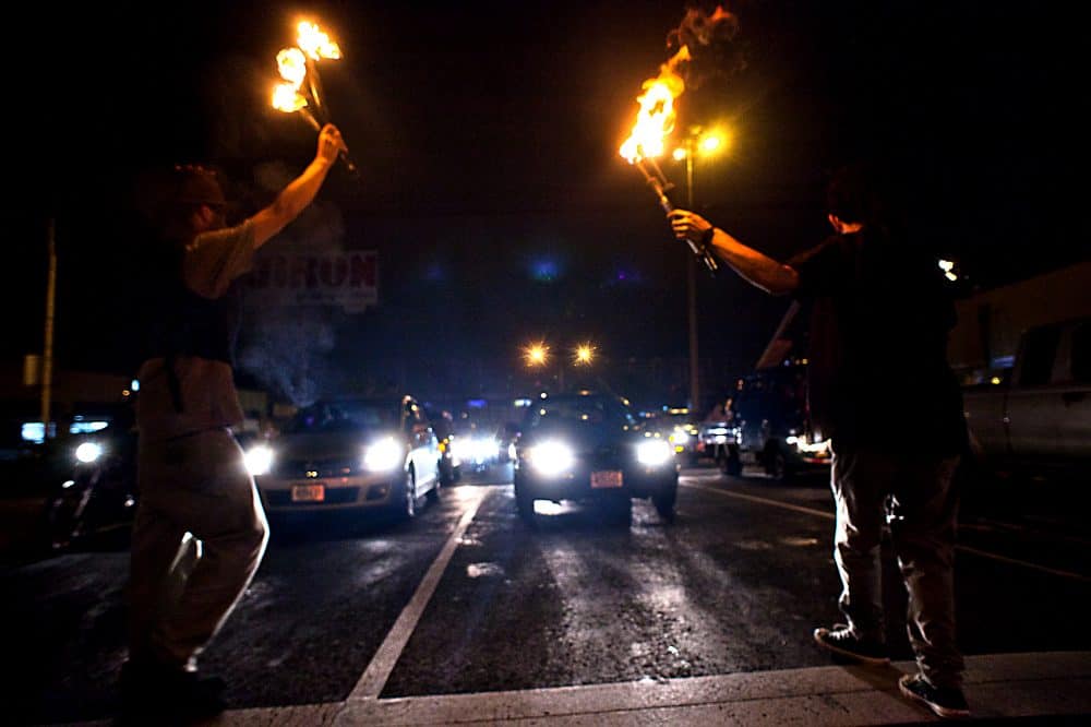 Fire dancer performing at night in Costa Rica's capital.