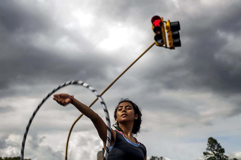 Hula hoop performer captivating onlookers with trick