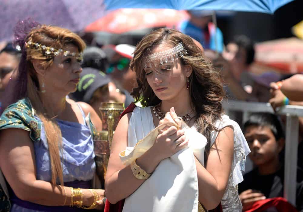 Spectators lining both sides of Avenida Central to observe the solemn Holy Week parade in San José Costa Rica