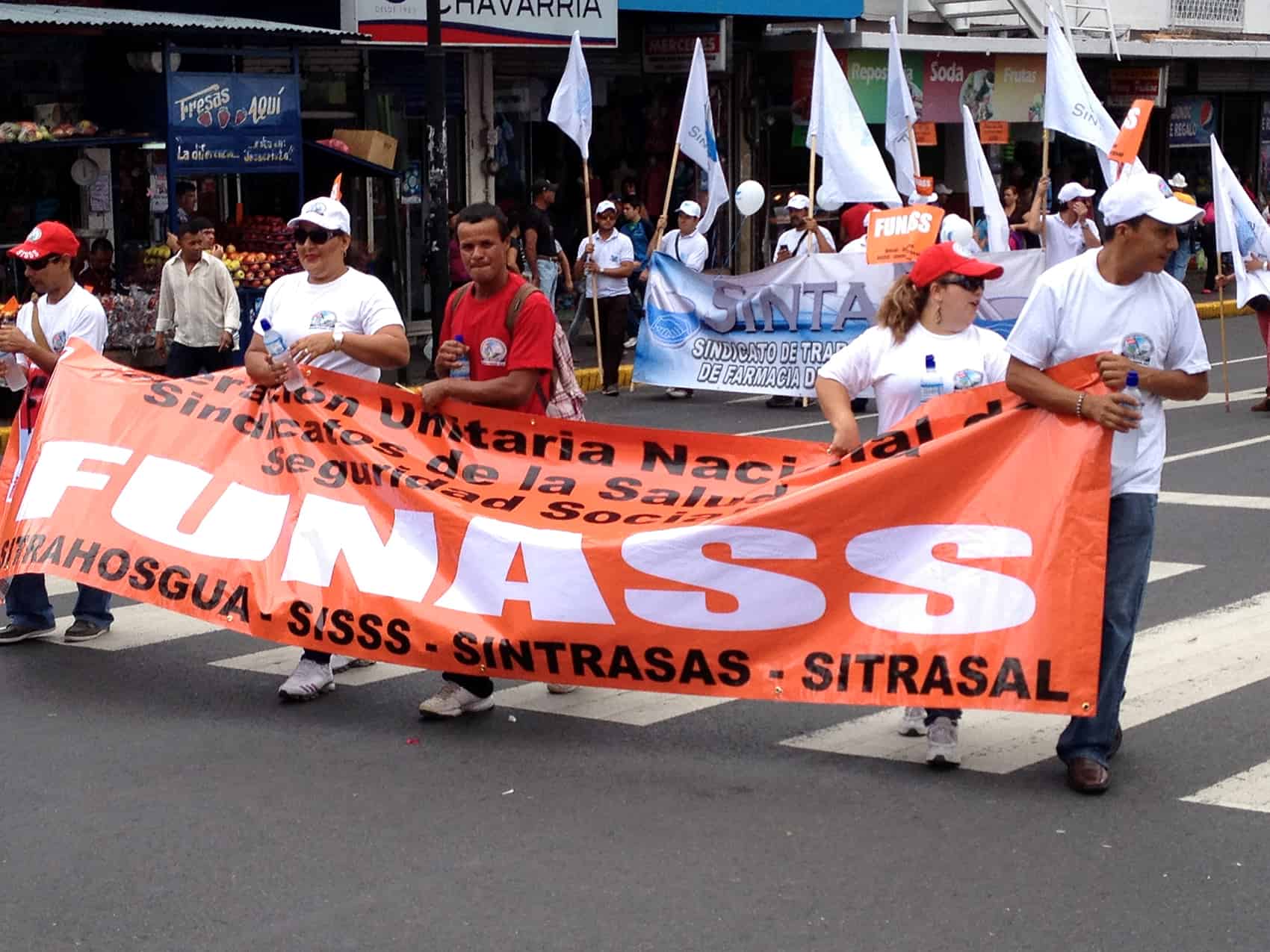 Workers march during Labor Day Parade
