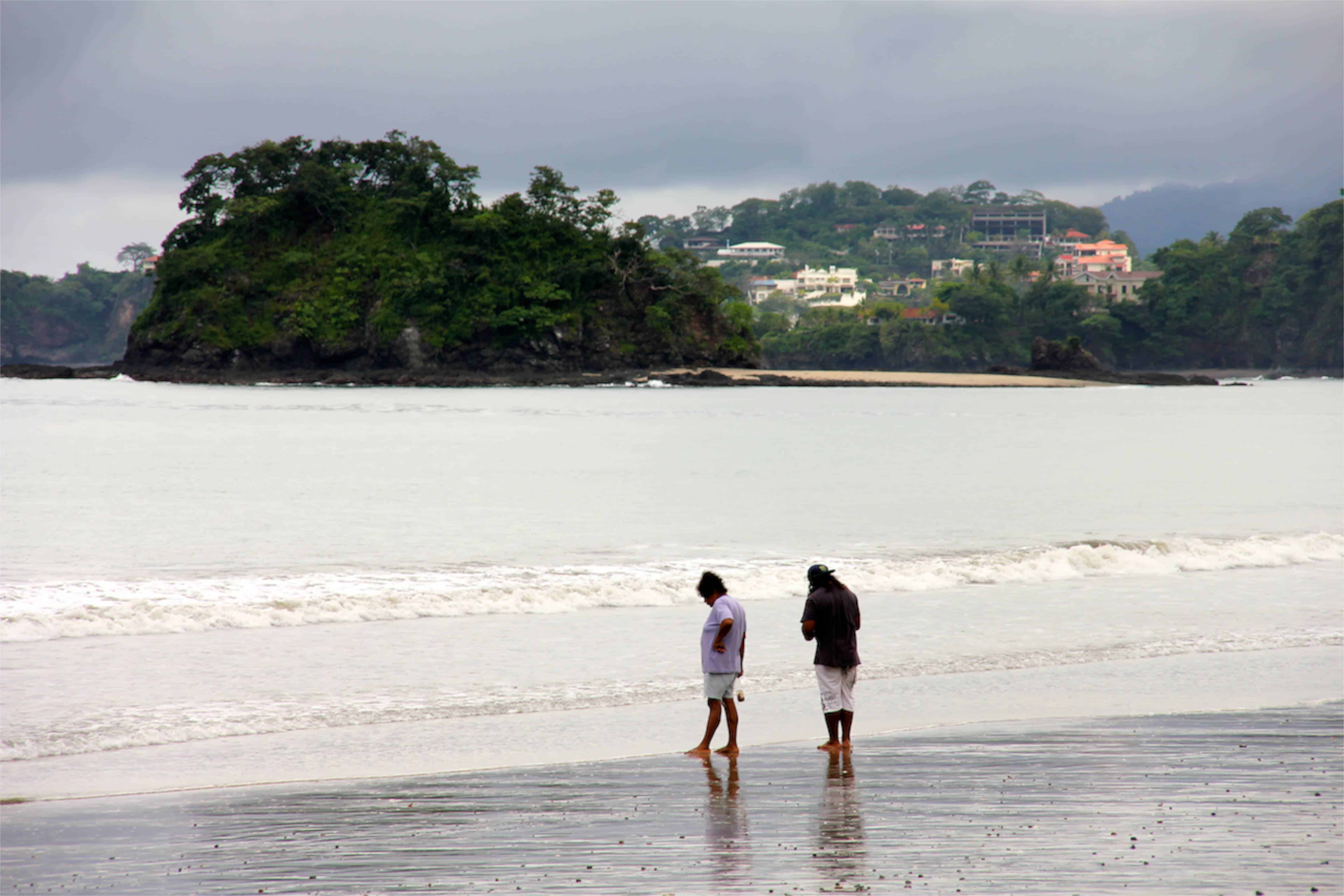 Beachgoers stroll the sands of Brasilito’s bay.