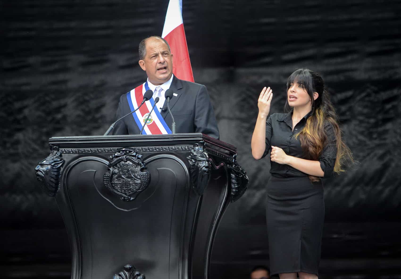 Estefanía Carvajal, right, signs President Luis Guillermo Solís' inauguration speech on May 8, 2014.