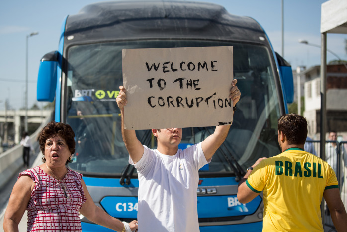 Brazilians protest during the inauguration of the BRT's new line.