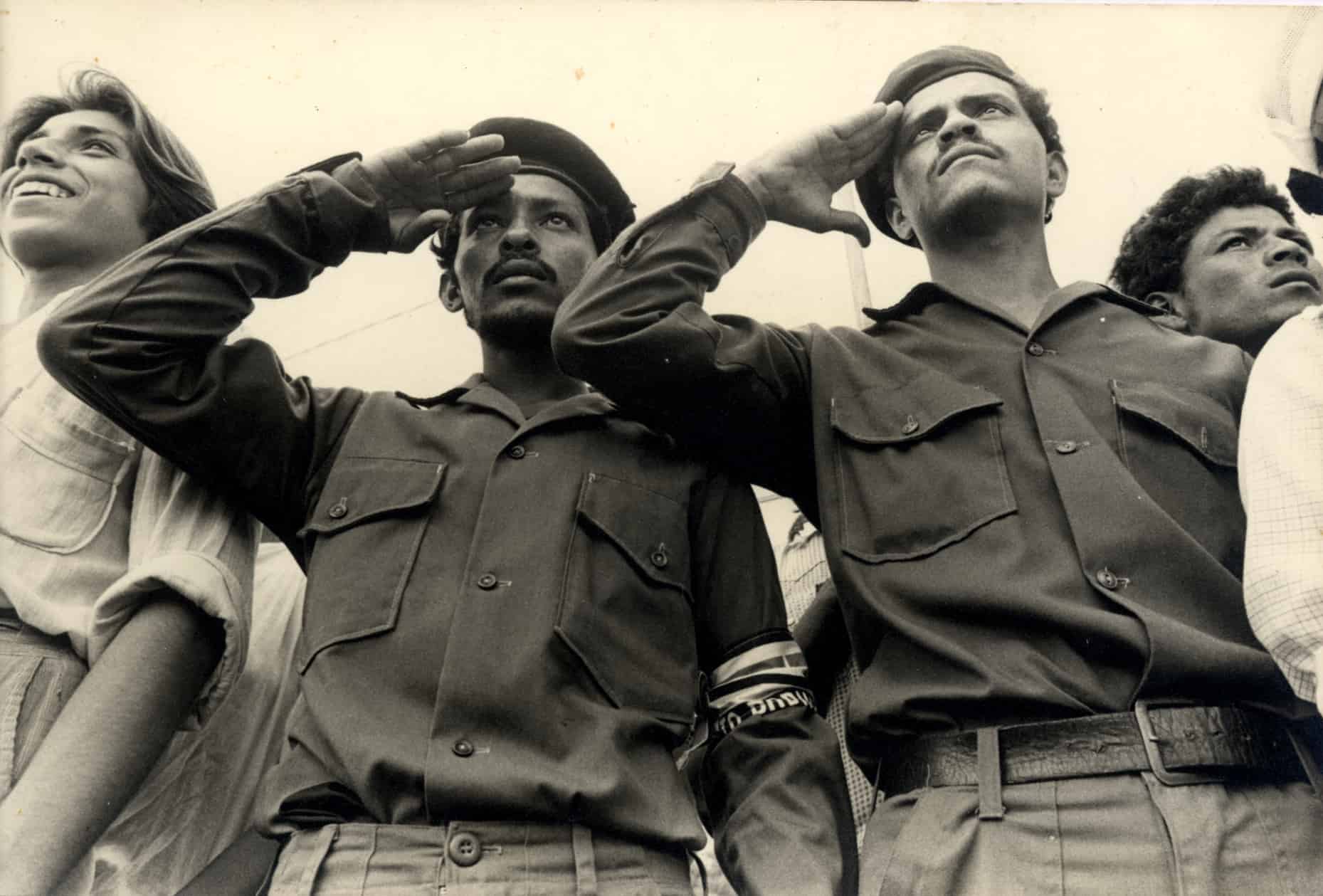 Nicaraguan Civilian guards salute during a military parade