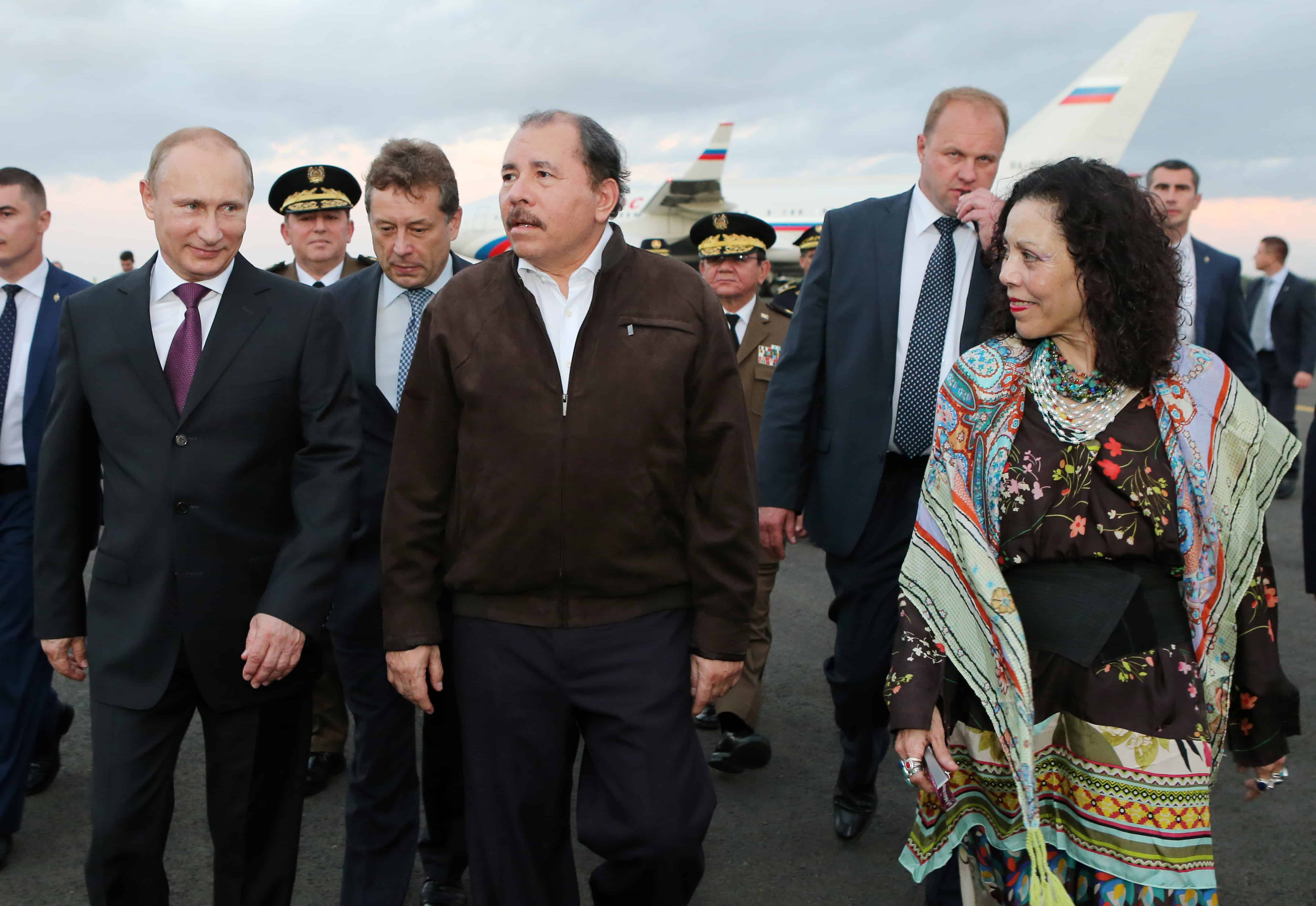 Russia President Vladimir Putin, left, walks with Nicaraguan President Daniel Ortega