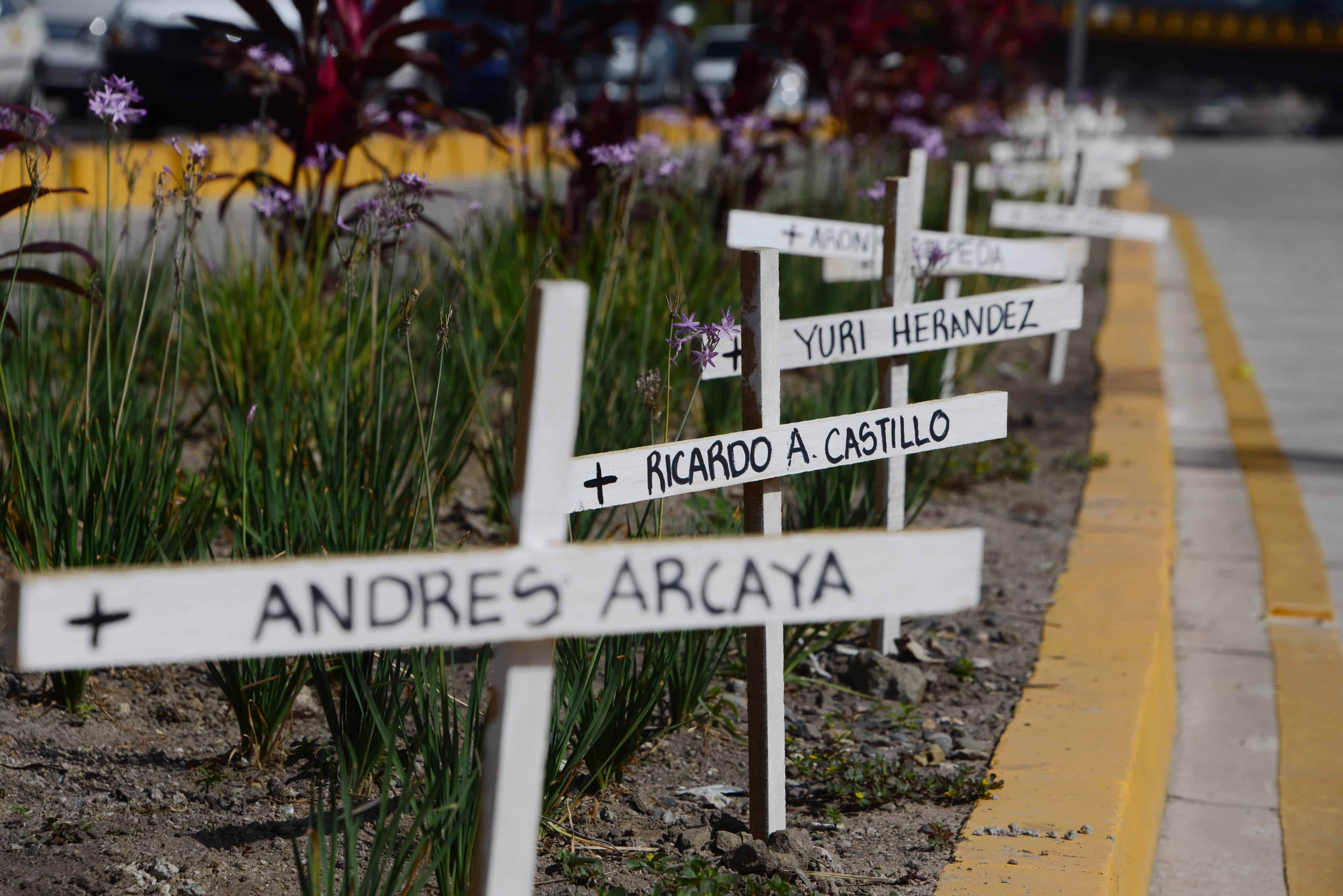 White crosses in memory of victims of violence are seen around Tegucigalpa.