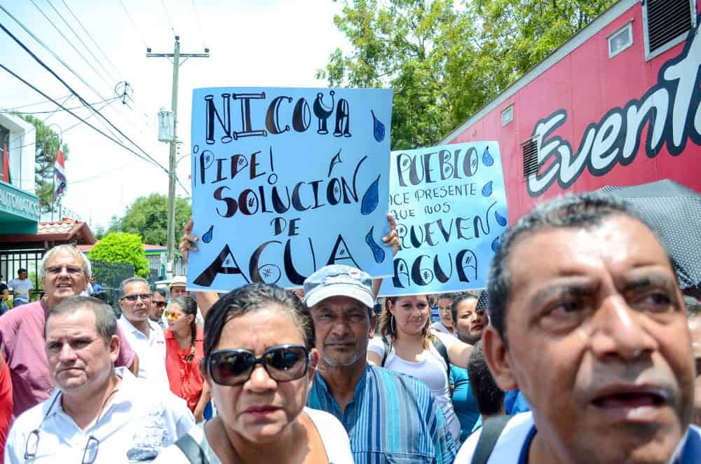 Protesters at the Nicoya annexation anniversary demand a solution for the water crisis in the Guanacaste province. Water in some regions had been contaminated with arsenic, and the province is also in the midst of a drought, July 25, 2014.