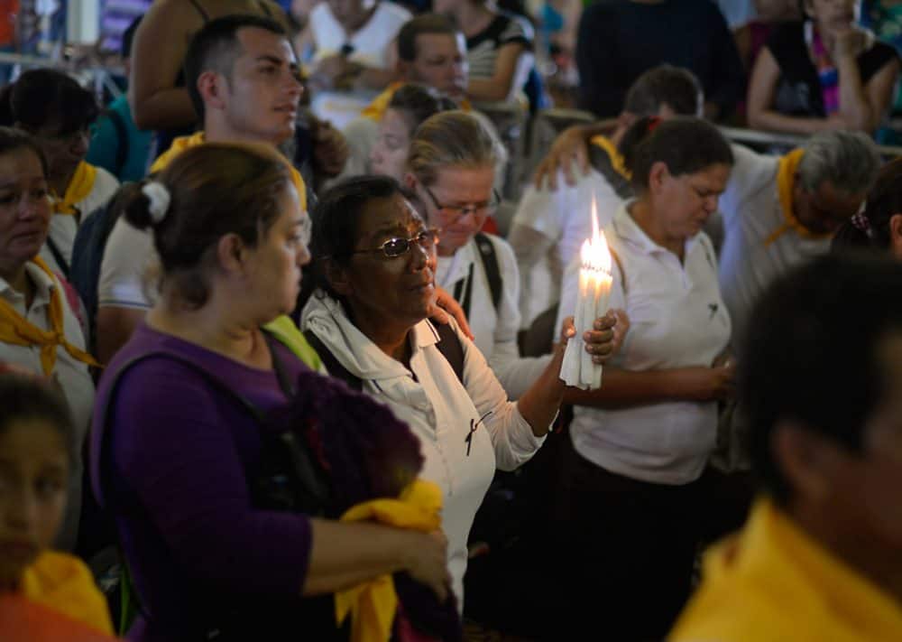 The Costa Rica faithful with candles inside the church during the Romeria, the country's largest religious event