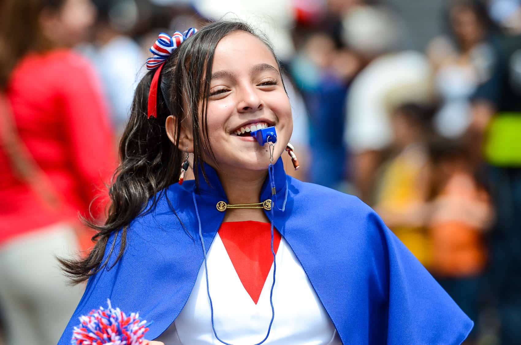 A student celebrating Costa Rica Independence Day during a Parade