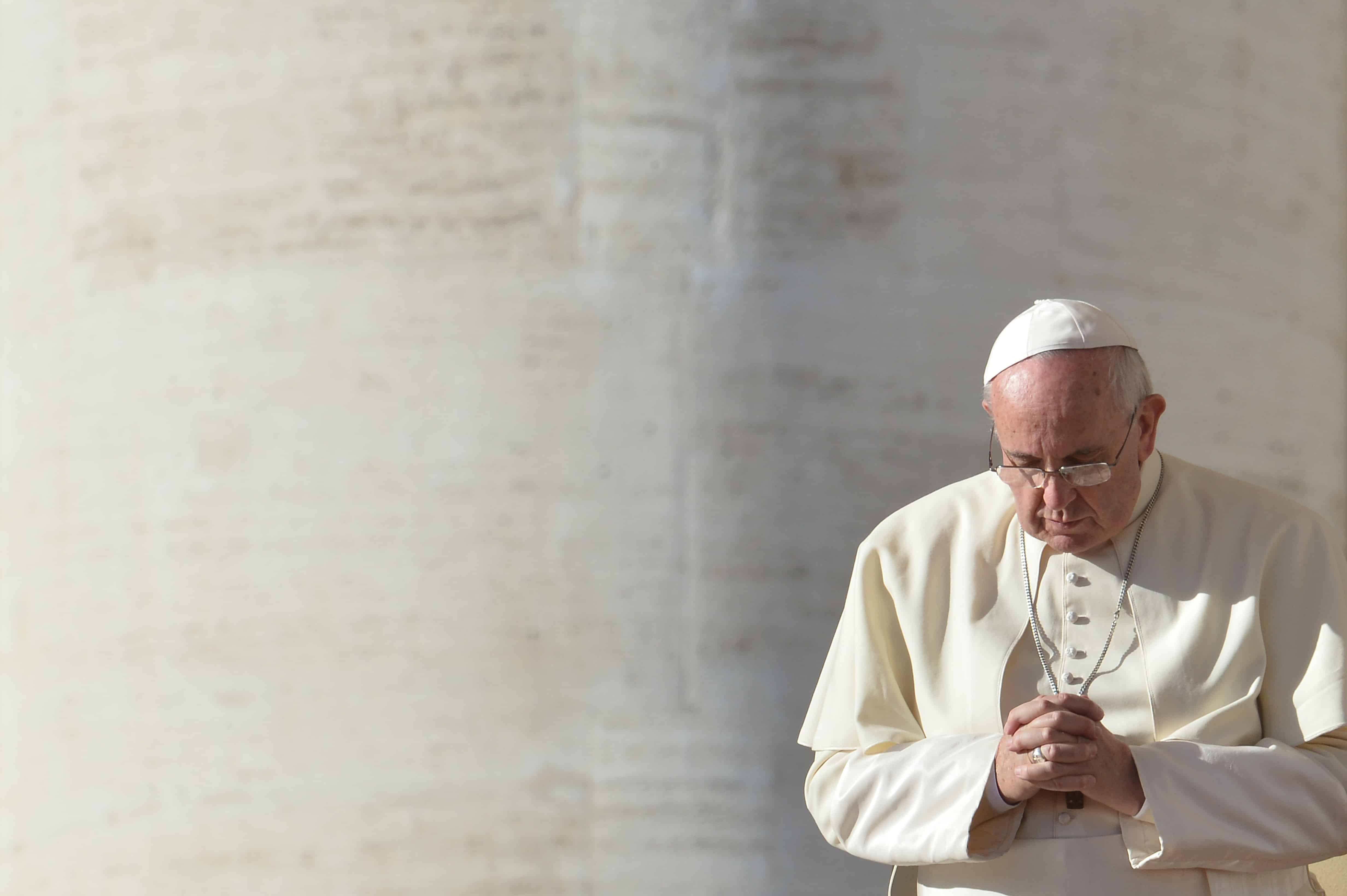 Pope Francis prays at St. Peter's square during his general audience on Dec. 17, 2014 at the Vatican.