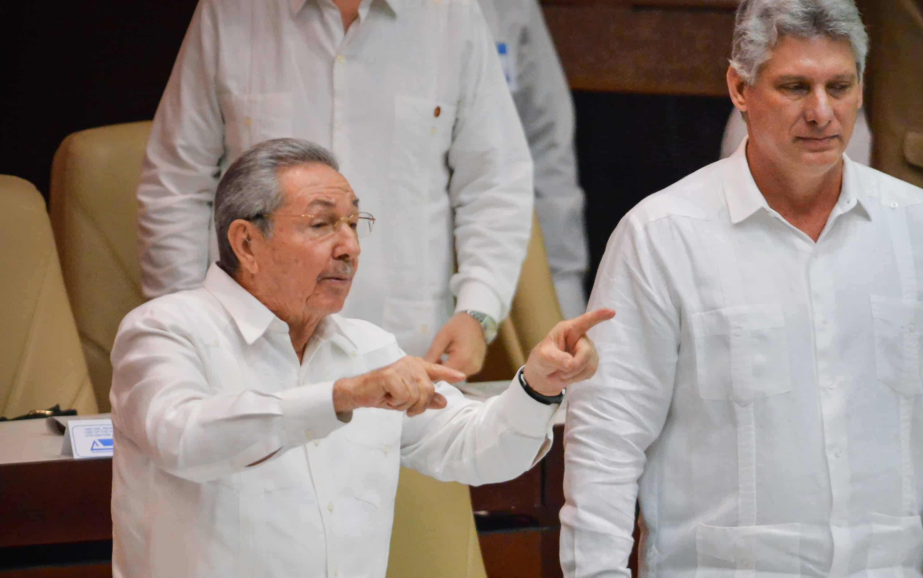 Cuban President Raúl Castro, left, gestures next to first Vice President Miguel Díaz-Canel at the end of the annual session of parliament on Dec. 20, 2014 in Havana.