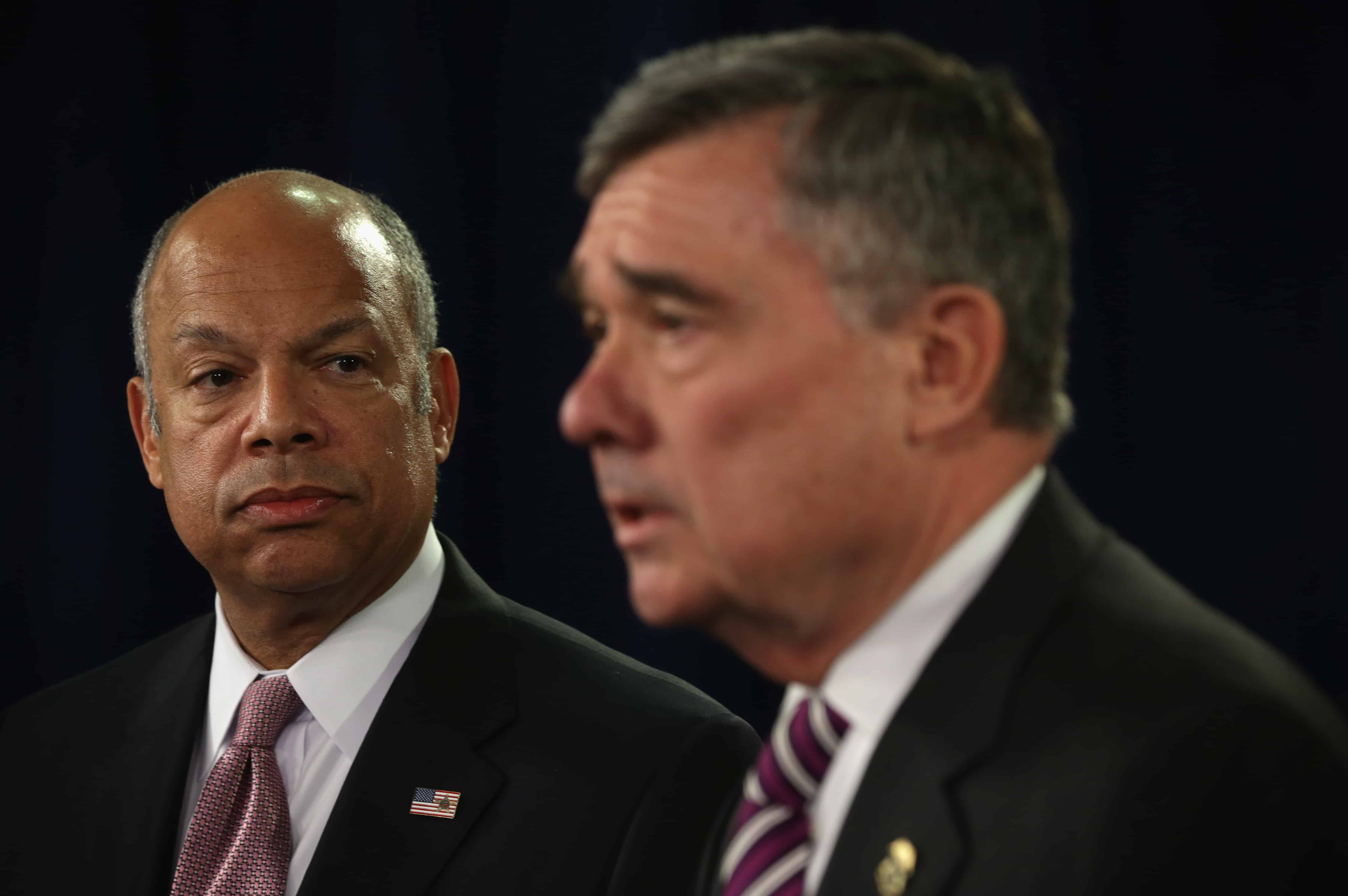 U.S. Secretary of Homeland Security Jeh Johnson (L) looks on as Gil Kerlikowske (R), Commissioner of U.S. Customs and Border Protection, speaks during a news conference February 23, 2015 in Washington, DC.