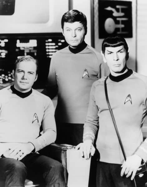 William Shatner, left, DeForest Kelley, center, and Leonard Nimoy pose on the set of the television series Star Trek in this undated photo. 