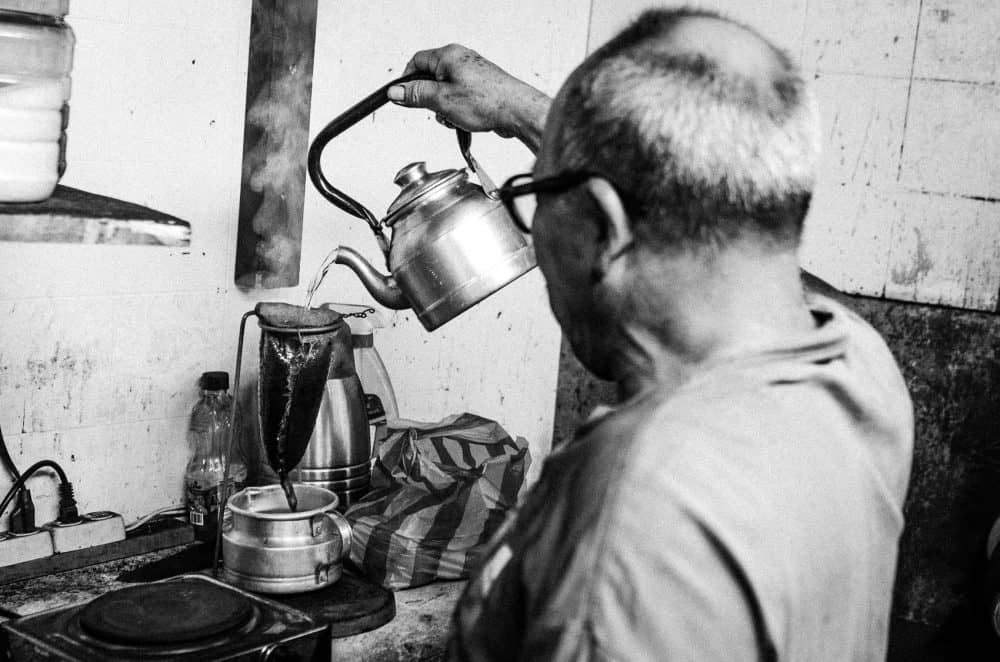 Making Coffee with a Chorreador at Costa Rica's Barrio Amón Historic Shoe Repair Shop 