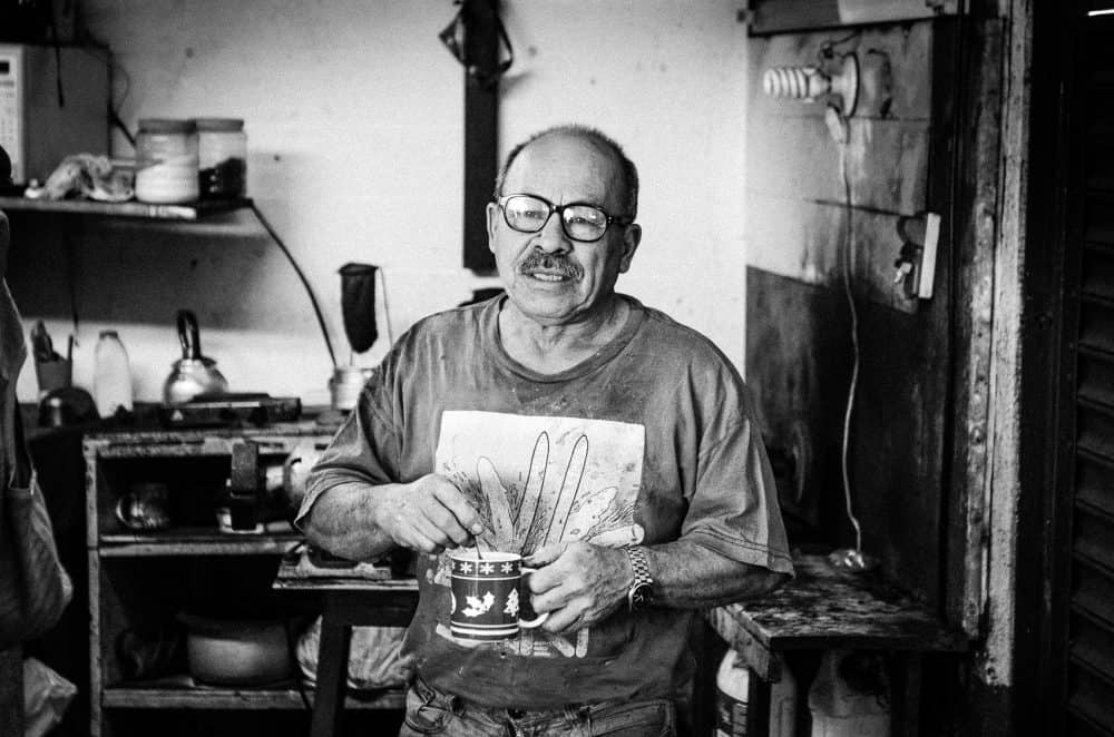 Smiling worker at Costa Rica's Barrio Amón Historic Shoe Repair Shop 