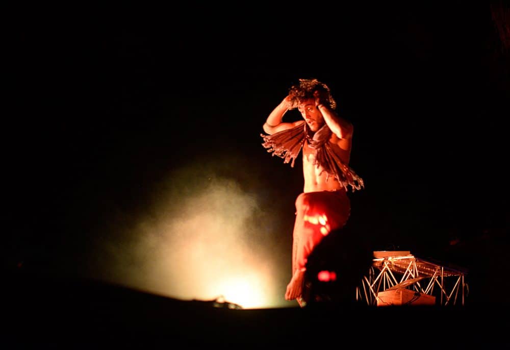 A performer dances on stage.