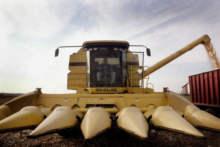 An Illinois farmer unloads a combine of corn.