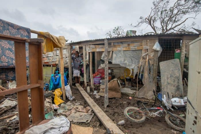 This handout photo taken and received on March 15, 2015 by UNICEF Pacific shows a resident's home badly damaged by Cyclone Pam, outside the Vanuatu capital of Port Vila. Cyclone-devastated Vanuatu declared a state of emergency on March 15 as relief agencies scrambled to get help to the remote Pacific nation amid reports entire villages were "blown away" when the monster storm swept through.  