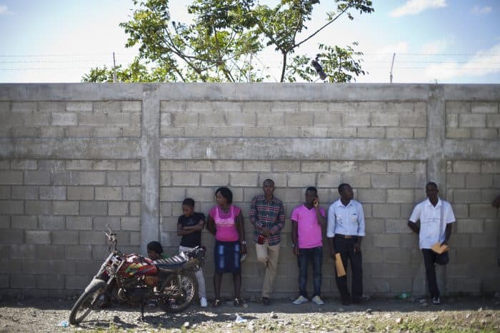 Job seekers wait to enter in Caracol Industrial Park, in Caracol, Haiti.