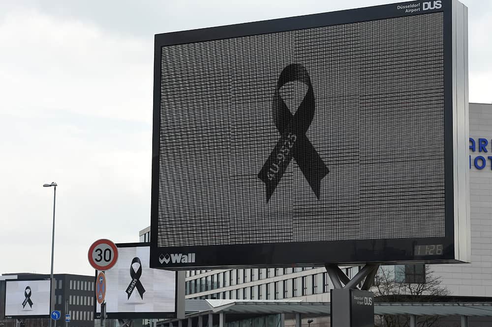 A LCD display shows a black ribbon with the flightnumber of Germanwings 4U 9525 at the Duesseldorf airport on March 26, 2015 in Duesseldorf, western Germany.