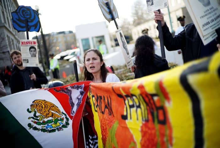 Demonstrators take part in a protest against the government of Mexico across from the State Department on March 26, 2015 in Washington, DC. The protesters are demanding justice for the 43 missing students from Ayotzinapa, Mexico.