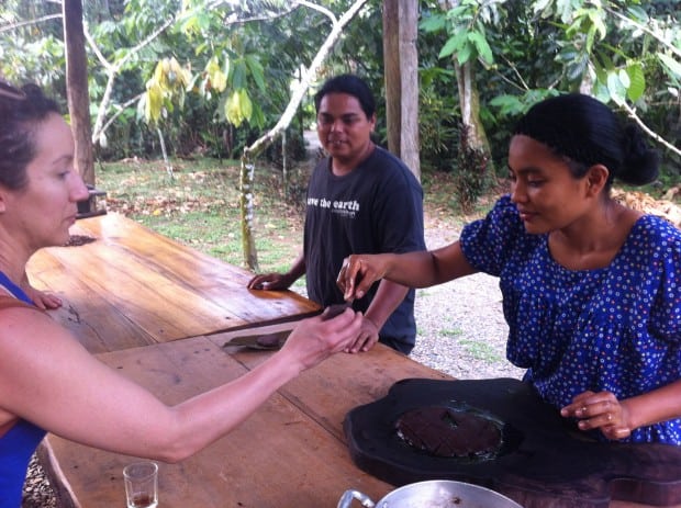 It’s tasting time! Eunice hands a chocolate sample to Linda Ureña. 