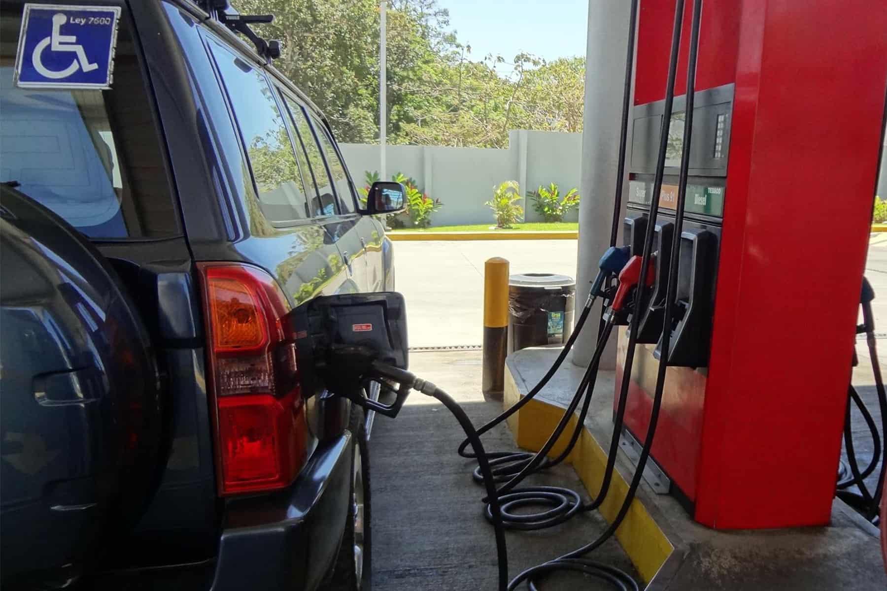A car at a gas pump.