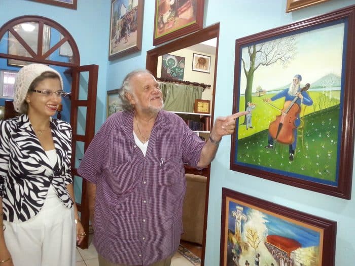 At the Preiss home in Granada, Nicaragua, Veronica and Kurt display their Jewish-themed artwork.