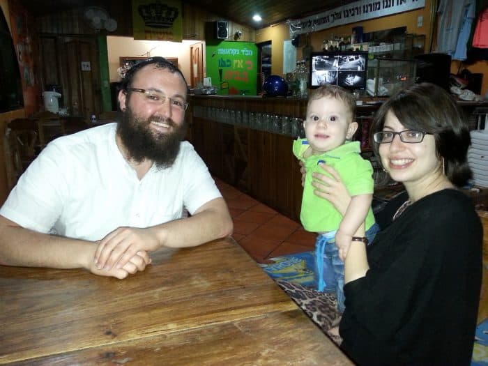 Rabbi David Atar, left, Rebbetzin Chana Atar, right, and their son,Levy Itzhak.