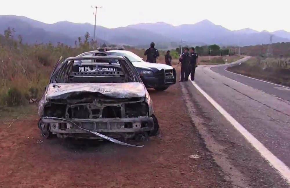 Mexican cartel hangs banners after cop massacre