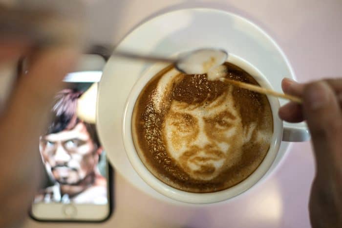 Barista Zach Yonzon uses coffee latte milk froth to illustrate Philippine boxing icon Manny Pacquiao.