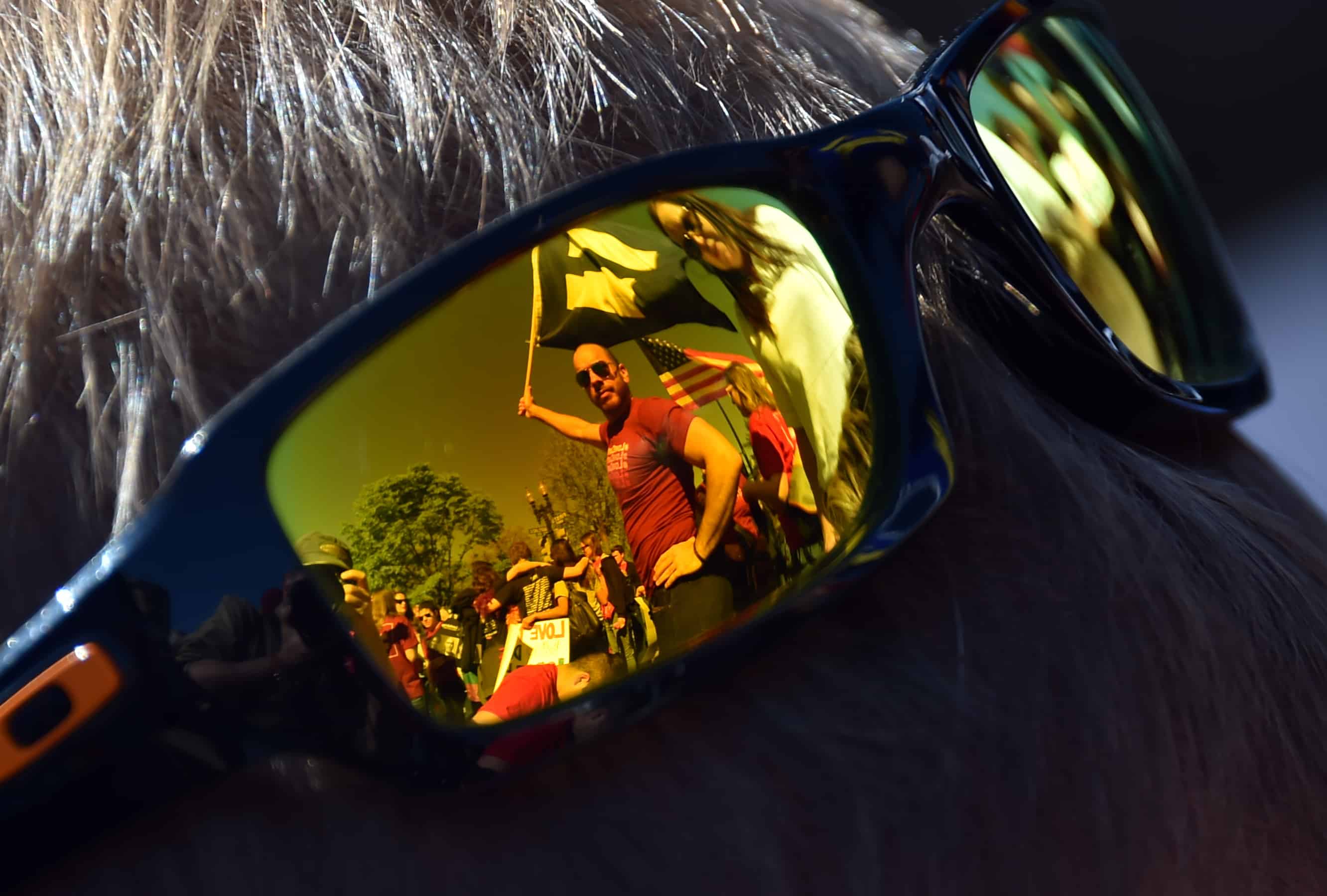Sunglasses reflect supporters of same-sex marriages standing outside the U.S. Supreme Court as they wait for its decision on whether gay couples have a constitutional right to wed, April 28, 2014 in Washington, D.C.