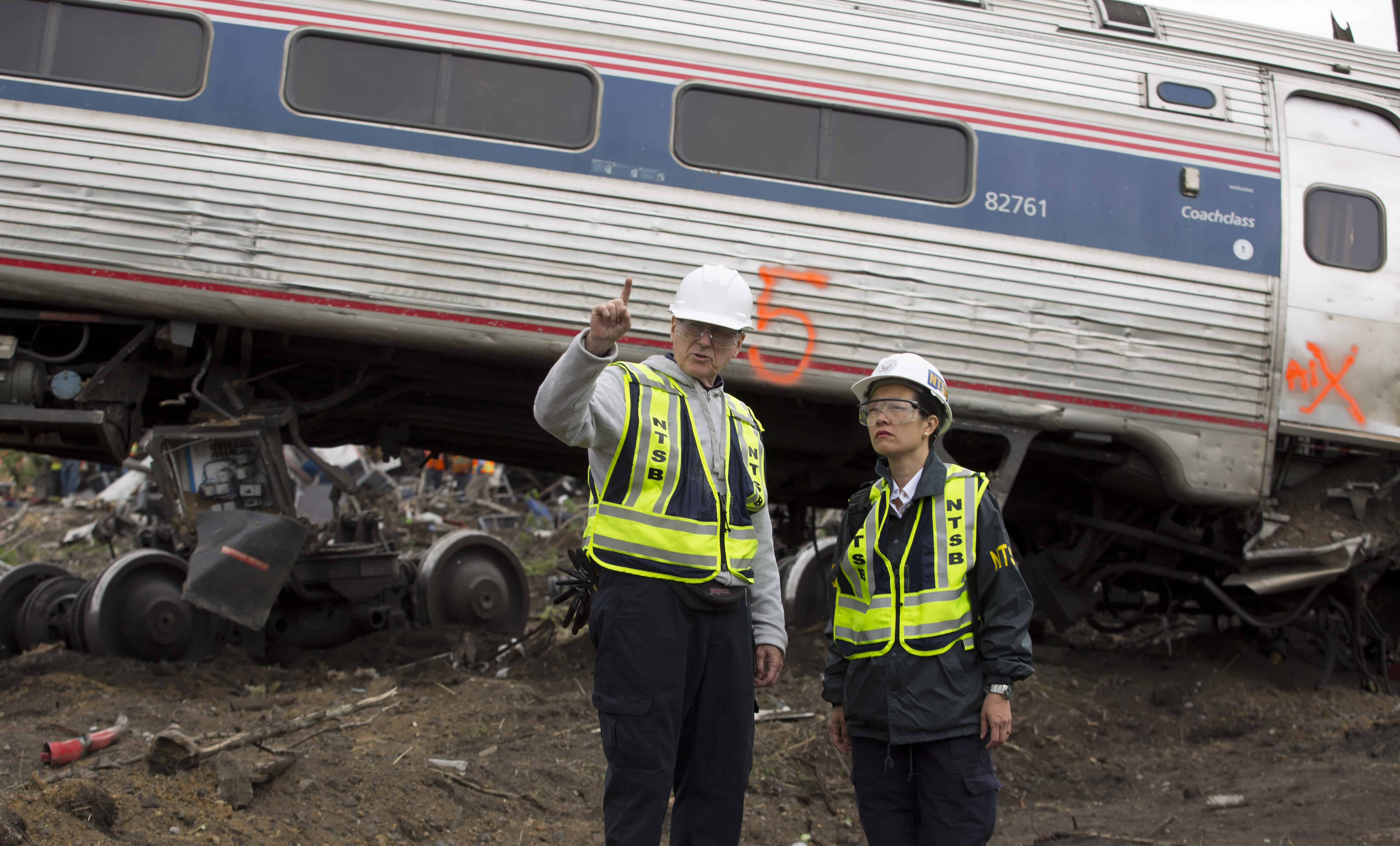 NTSB Rail Safety Investigator Mike Flanigon (left) briefs Vice Chairman Dinh-Zarr at the scene of an Amtrack train that derailed in Philadelphia, Penn., May 13, 2015.