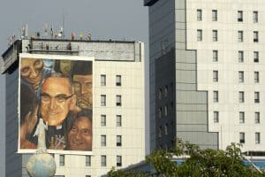 Workers hang a giant painting on May 19, 2015 dedicated to Monsignor Oscar Romero (1917-1980), who will be beatified next May 23, in San Salvador.