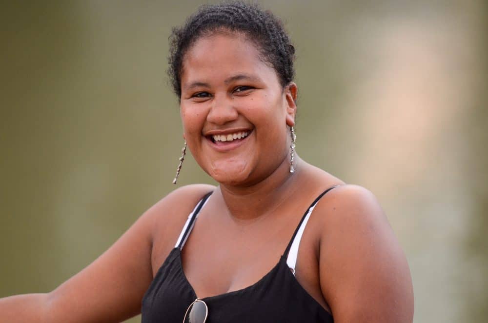 Gabriela, a Los Chiles resident poses for a photo at the banks of Costa Rica's Río Frío, 