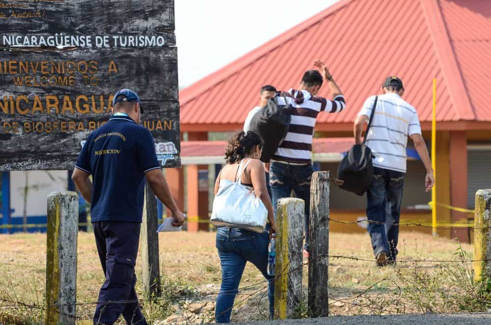 A group of Nicaraguan migrants caught crossing the border are escorted back to Nicaragua by the Costa Rican migration police,