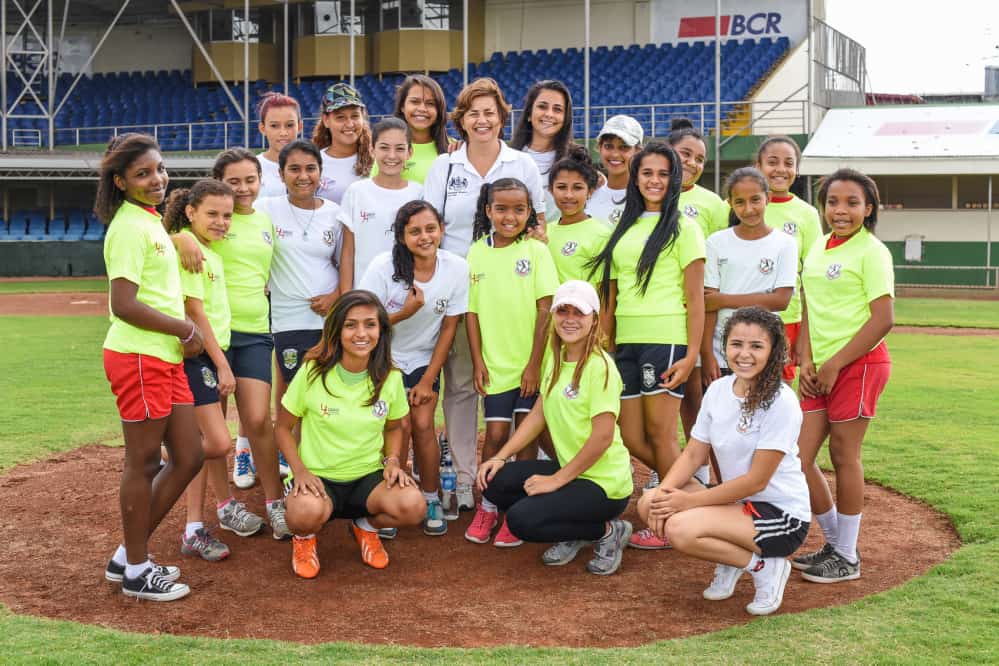 Girls taking part on the just inaugurated Women's Cricket Association pose for a photo with British ambassador Sharon Campbell (center).