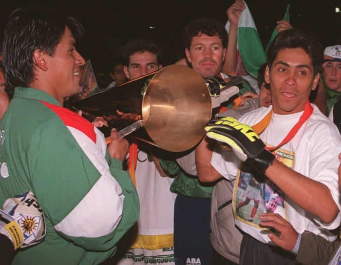 Goalkeeper Jorge Campos, right, carries the Gold Cup trophy along with teammates after Mexico defeated Brazil 2-0 in the championship match of the CONCACAF Gold Cup in 1996. 