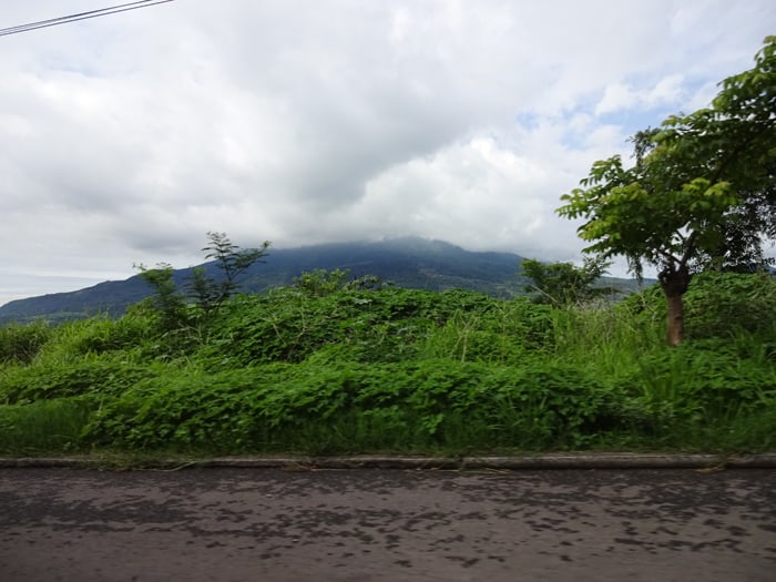 A mountain — volcano? — shrouded by clouds in El Salvador.