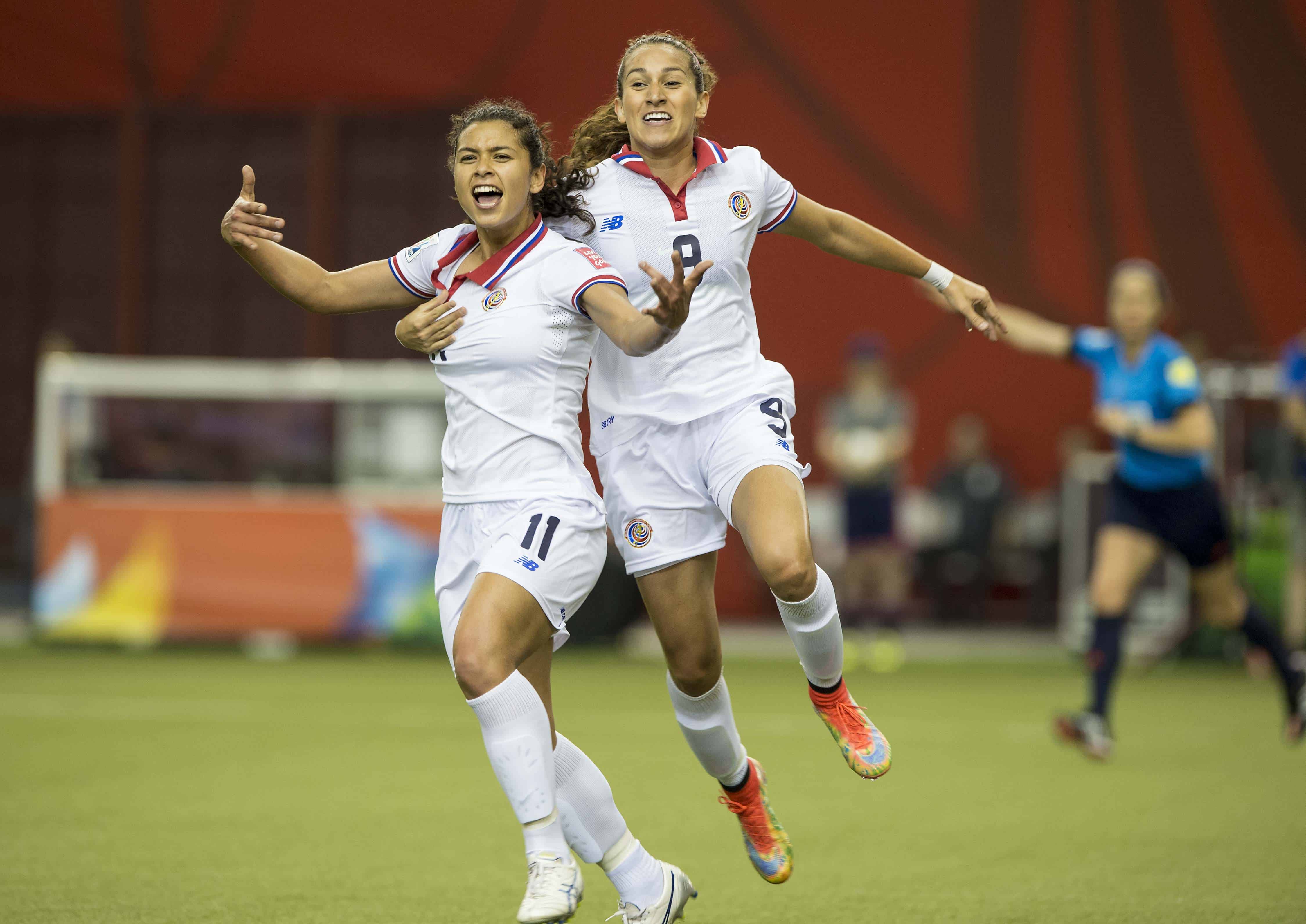 Costa Rica's Raquel Rodríguez, left, celebrates after scoring against Spain, with Carolina Venegas.
