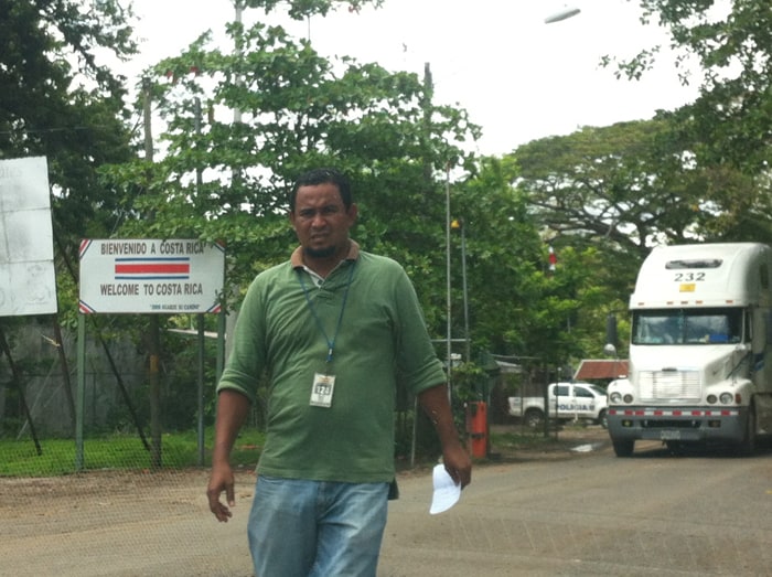Gabriel, ultra-competent Tico border fixer, approaches our car.