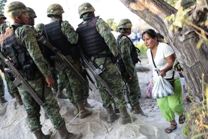 Mexican soldiers block the way during a protest of residents of Ayutla.