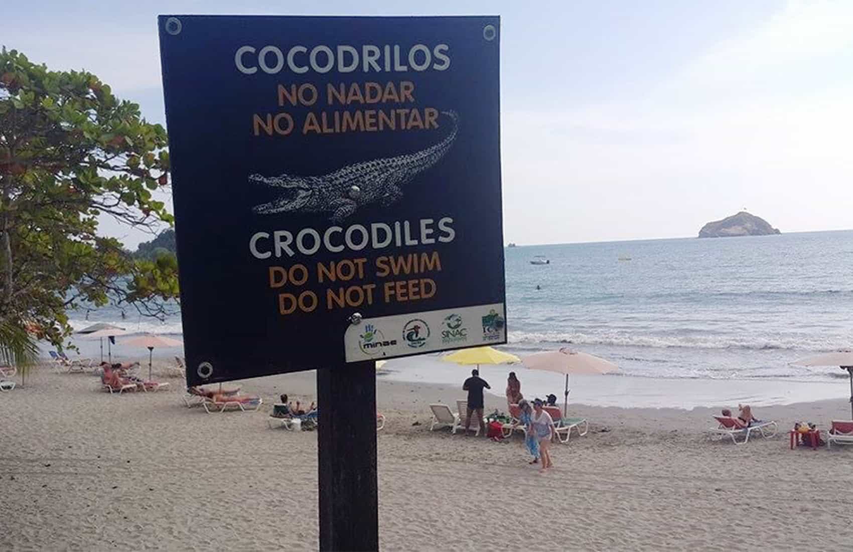 Crocodile warning signs on the beach in Costa Rica