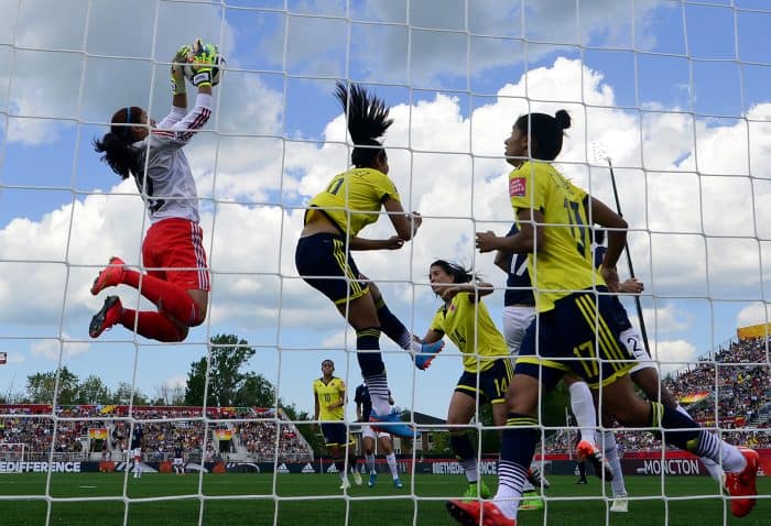 Colombia's goalkeeper Sandra Sepulveda, left, stops the ball during a Group F match.