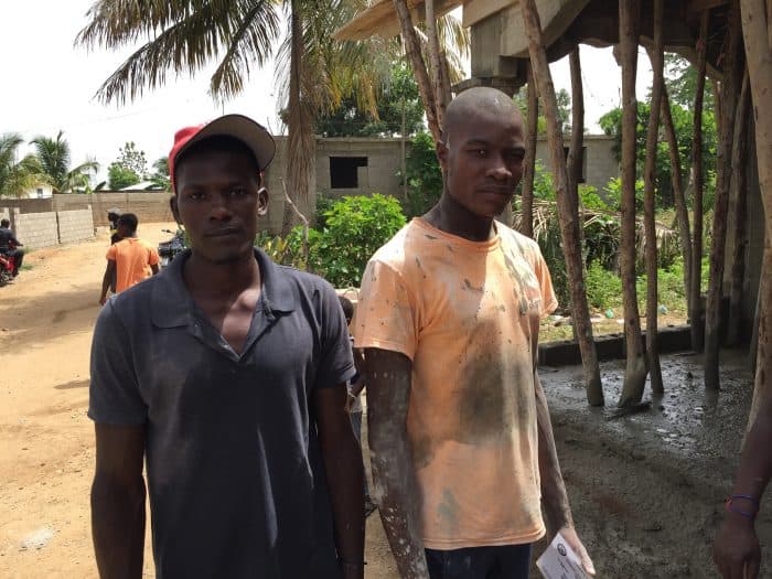 Thony Dume, 29, left, and his brother Felix Mondesir, 24, work on June 19 on the rented shack in Ouanaminthe, Haiti.