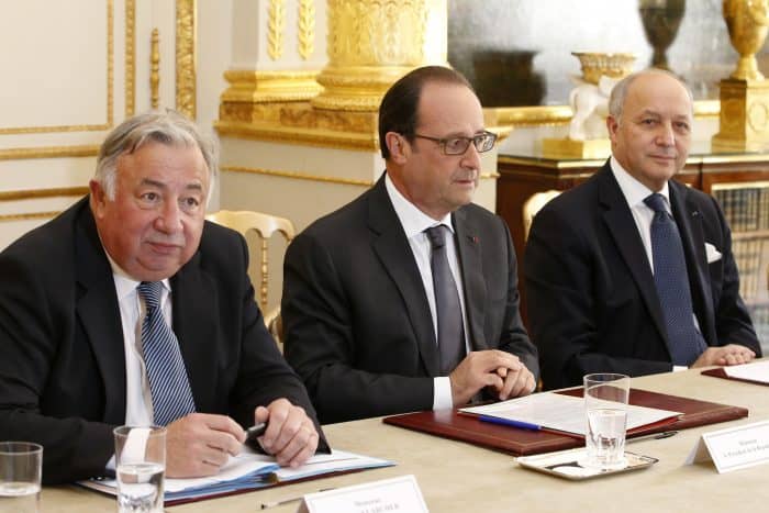 French Senate President Gerard Larcher, left, French President Francois Hollande, center, and French Foreign Minister Laurent Fabius.